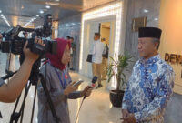H. Fauzan Khalid (pakai peci hitam).